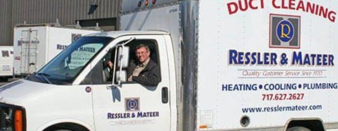 a man inside the ressler and mateer service truck ready to go out on a job